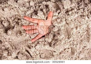 bigstock-Hand-on-a-beach-sinking-or-dro-30529991